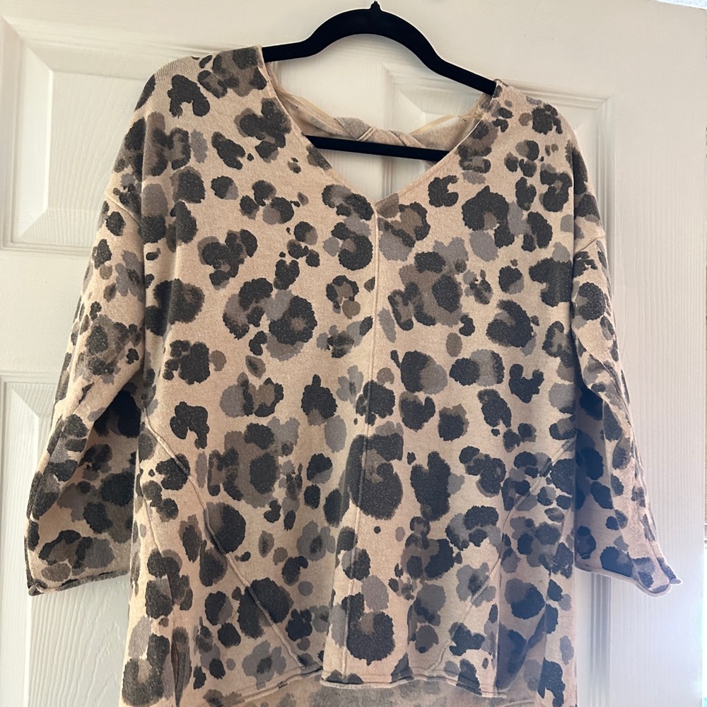 Cheetah print sweater with cut out in back